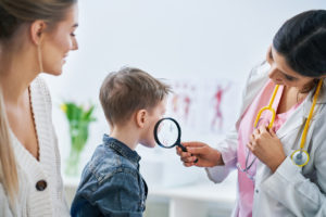 Doctor examining a child's skin