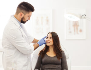 Young Female Patient at Cosmetic Dermatologist' clinic
