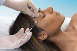 A woman getting cosmetic dermatology treatment