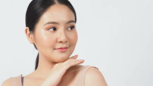 Beauty and skin concept. Young asian woman beauty face make up for skincare cosmetic and showing natural wellness soft and firm and ageless facial skin. she younger-looking or youthful. real acne no retouch.