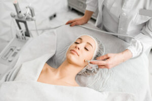 Woman during the facial treatment procedure