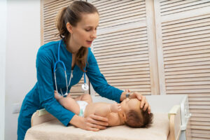 Pediatric Dermatologist taking care of a baby